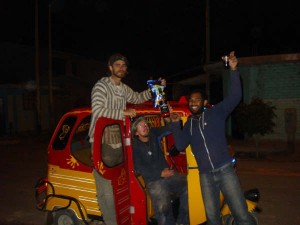 Kicking it outside the tuk-tuk.