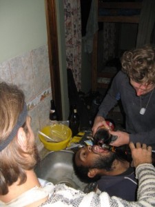 Mixto pouring Coke and Tuvo pouring Rum into Ravi's mouth.  We call that the dentist chair.