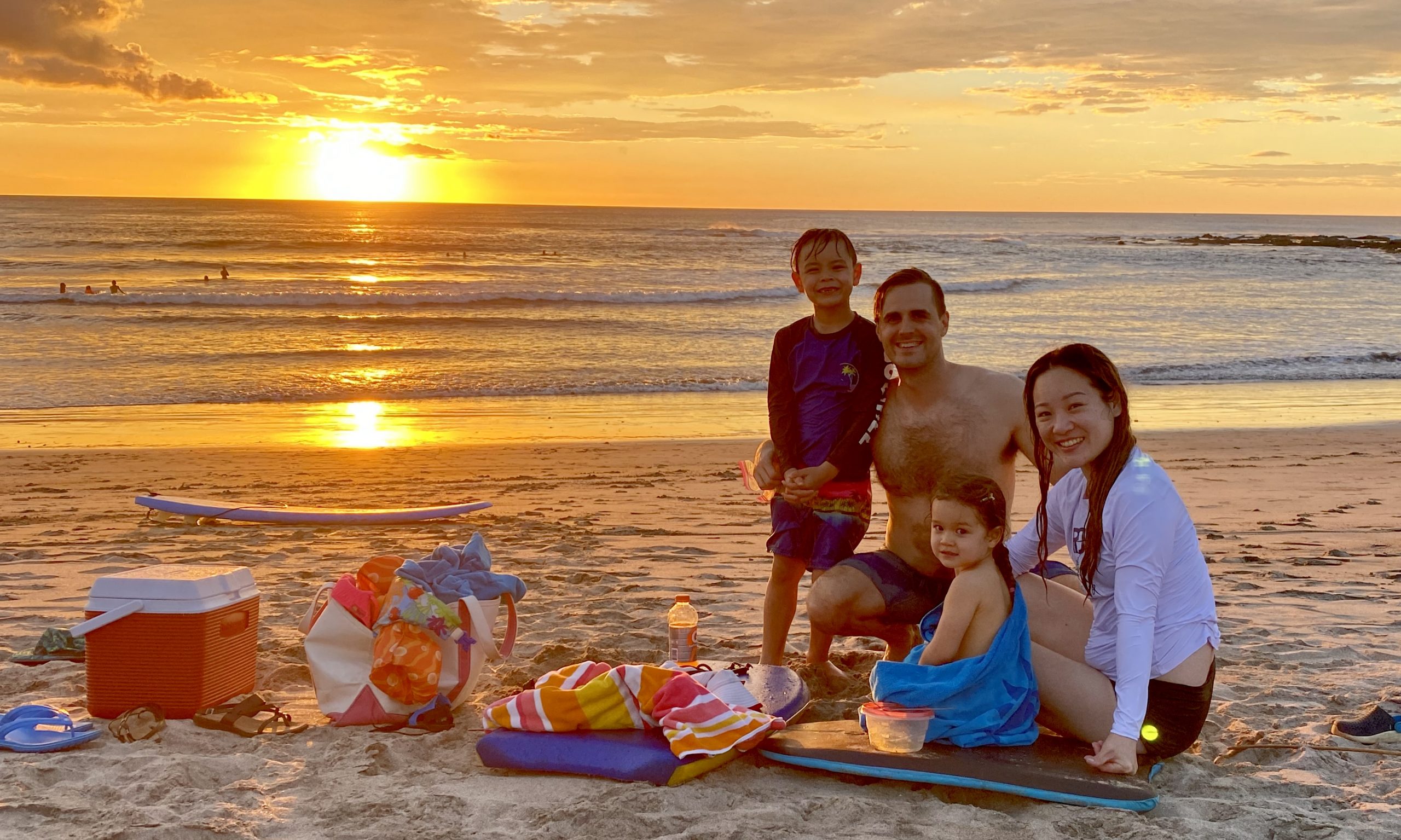 Our family enjoying a sunset at the beach